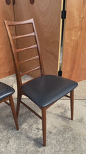 Load and play video in Gallery viewer, Set of Four (4) Danish Modern "Lis" Ladderback Dining Chairs in Walnut by Niels Koefoed for Koefoeds Hornslet, Denmark, c. 1960's