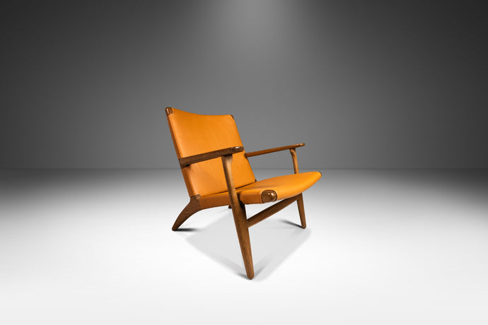 Danish Mid-Century Modern Model CH 25 Lounge Chair in Oak and Leather by Hans J. Wegner for Carl Hansen & Søn, Denmark, c. 1950's-ABT Modern