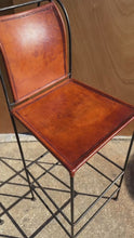 Load and play video in Gallery viewer, Set of Two (2) Counter Height Wrought Iron Spanish Hacienda Barstools with Hand-Worked Full Grain Leather, c. 1960s
