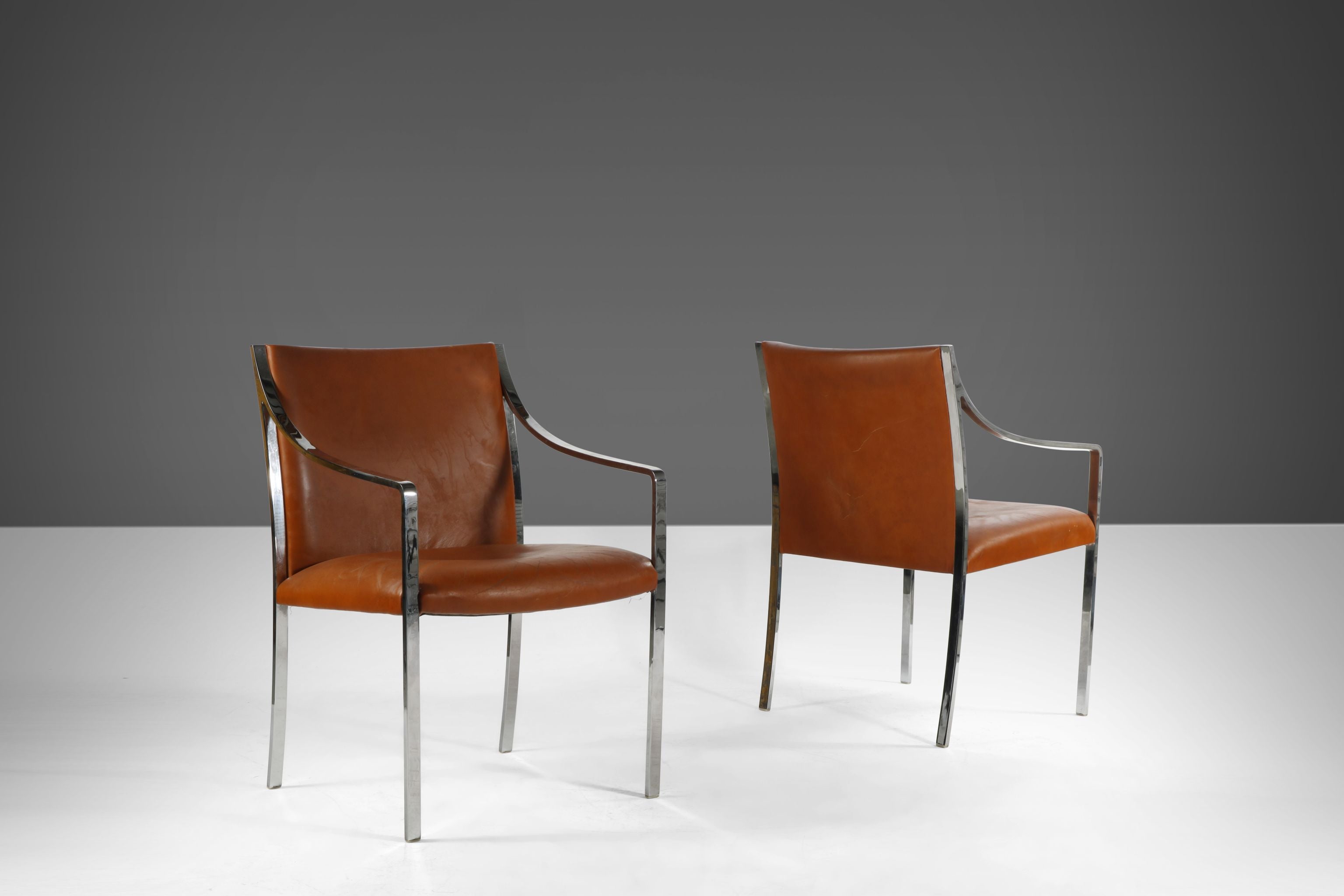 A Set of Two Chrome Accent Chairs in Original Naugahyde by Bert